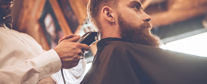 Men's Getting Hair Styled At Barbershop
