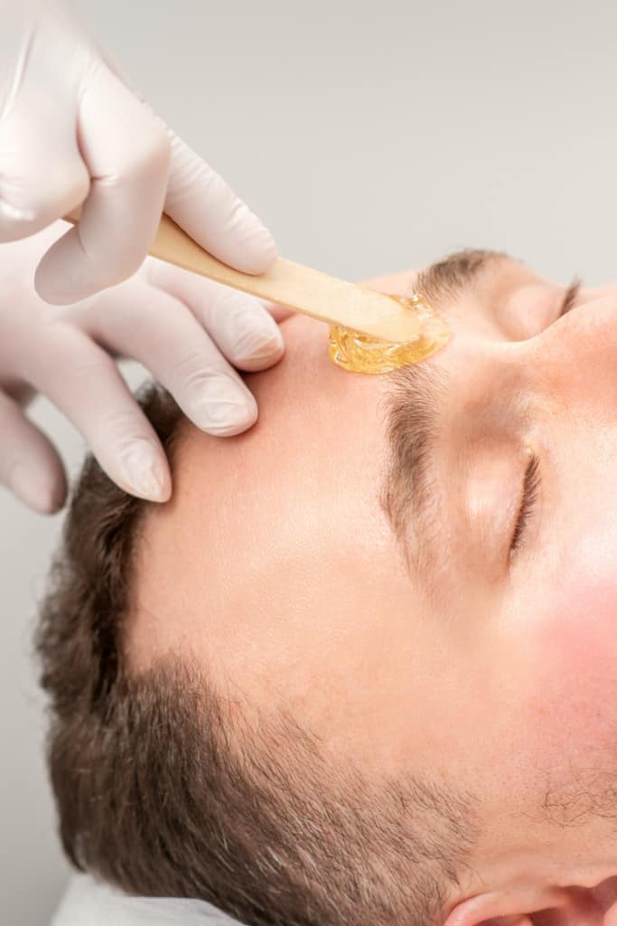Man Getting Eyebrows Professionally Waxed