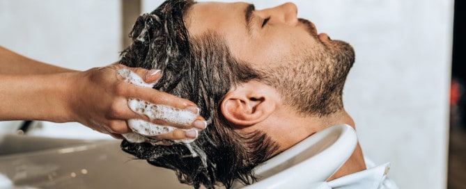 Stylist Washing Client's Hair